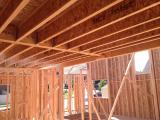 Standing in Kitchen viewing music room on left and stairwell and half bathroom back right