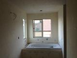 Texture plaster in master bathroom